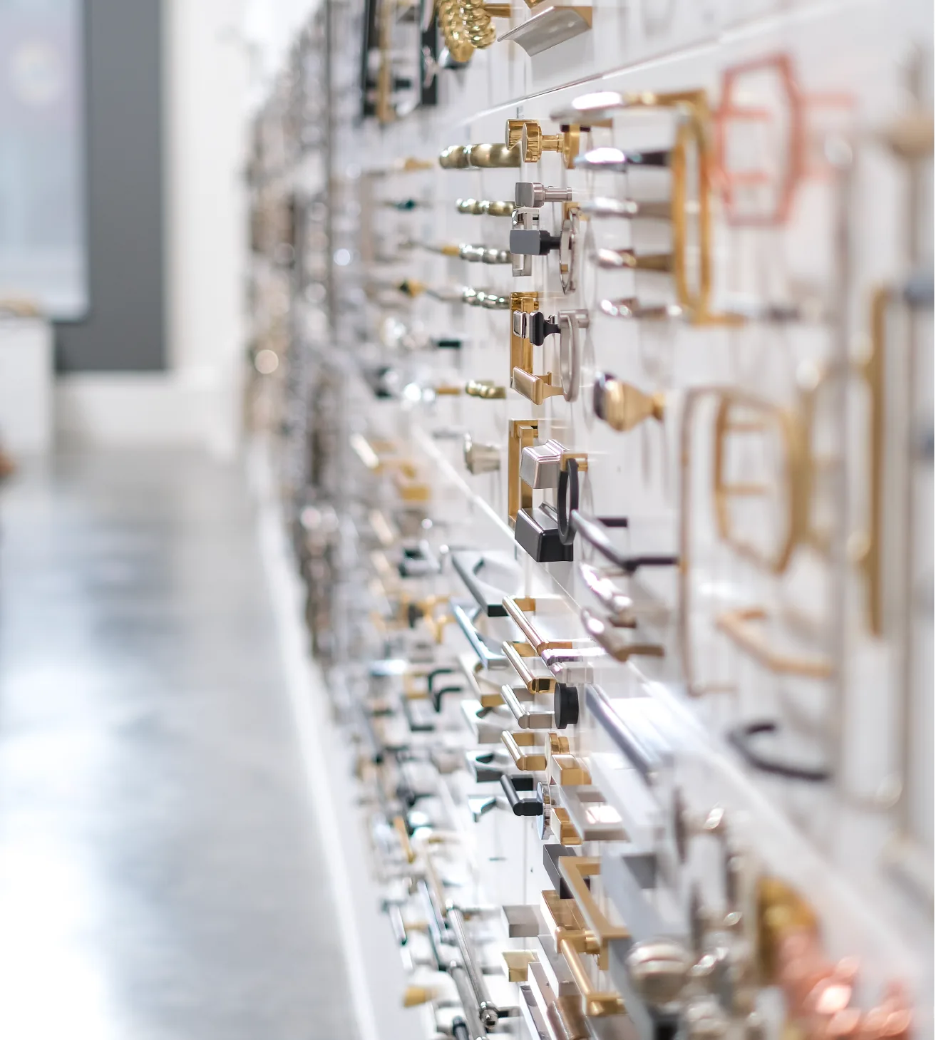 Wall of cabinet hardware on display in the Bradford Hardware showroom
