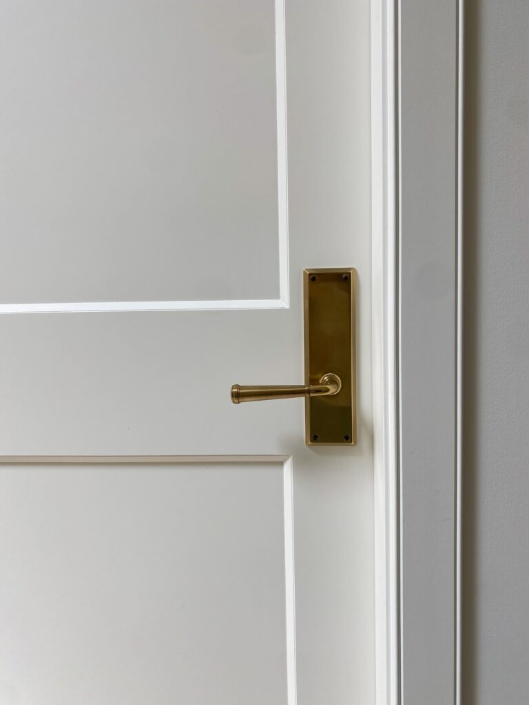 A solid-core door finished in brass, by Smythe Studio.